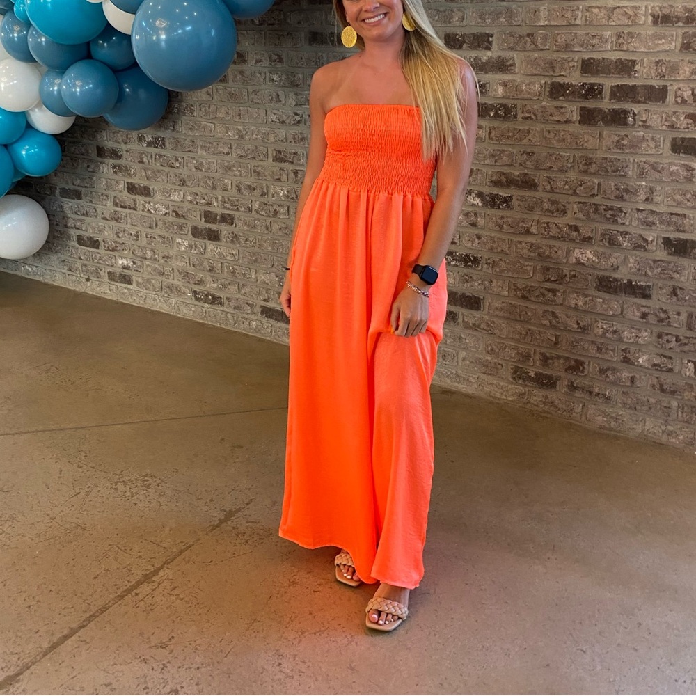 Vibrant Orange Strapless beautiful romper. Worn one time for a fashion show.